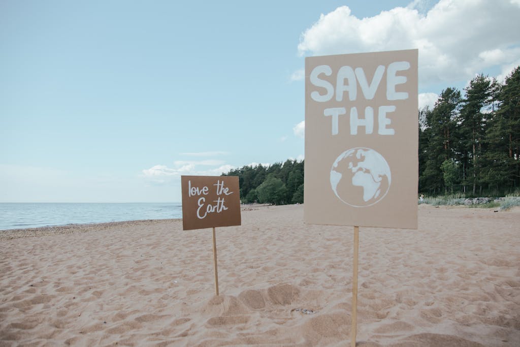 Love the earth and save the earth signs in the sand