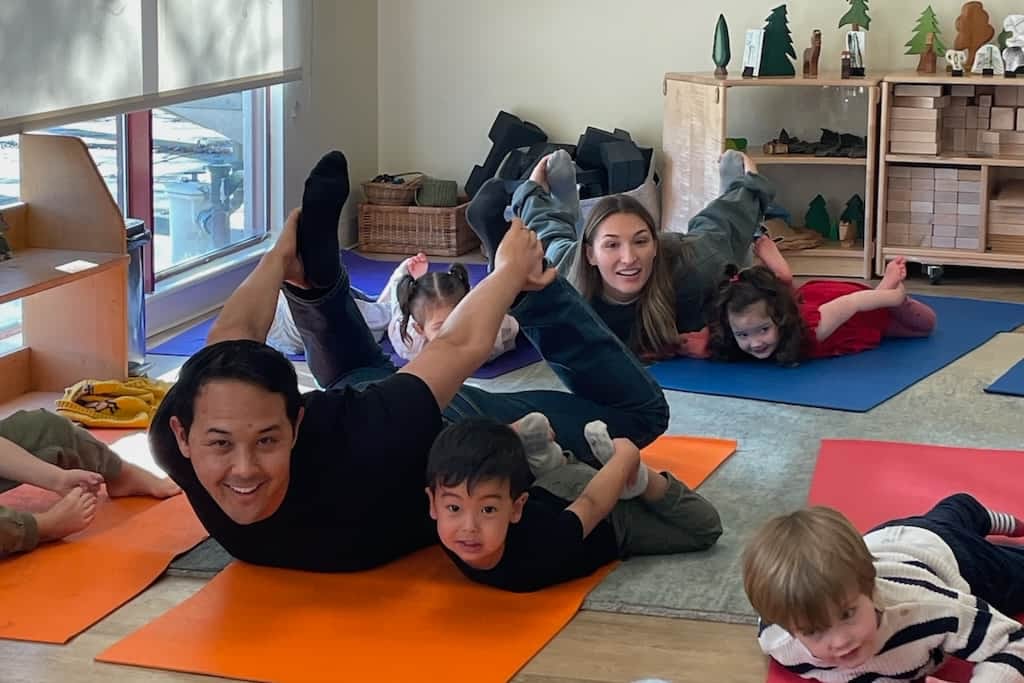A dad and his son doing yoga together