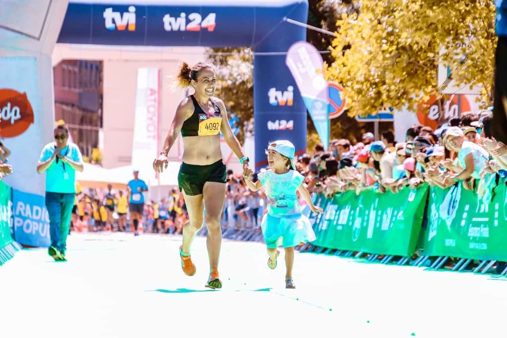 A mother and daughter finishing a race