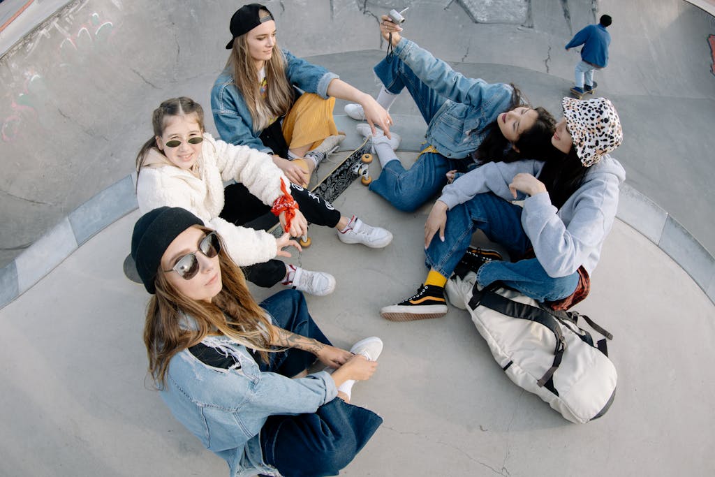 A circle of 5 teenage girls