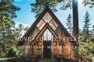 An A-frame building in the woods at Spirit Camp, Mendocino